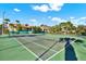 A view of the community tennis courts, perfect for an active lifestyle and friendly competition at 4002 Crockers Lake Blvd # 1-128, Sarasota, FL 34238
