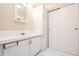 Bathroom features a clean, well-lit vanity and updated fixtures and generous storage at 472 Trout Ln, Oldsmar, FL 34677