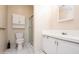 Standard bathroom featuring a toilet, vanity with sink, and shower with glass doors at 472 Trout Ln, Oldsmar, FL 34677