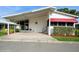 Charming single-story home featuring an inviting carport and well-maintained landscaping at 472 Trout Ln, Oldsmar, FL 34677