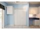 Kitchen area featuring ample storage, a built-in desk, and tile flooring at 472 Trout Ln, Oldsmar, FL 34677