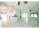 The open floor plan connects the kitchen and living room, creating a spacious and inviting atmosphere at 472 Trout Ln, Oldsmar, FL 34677