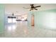 The open floor plan connects the kitchen and living room, creating a spacious and inviting atmosphere at 472 Trout Ln, Oldsmar, FL 34677