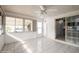 Inviting sunroom with tile flooring, large windows, and plenty of natural light at 472 Trout Ln, Oldsmar, FL 34677