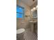 Bathroom featuring modern fixtures, a pedestal sink, toilet and decorative tile floor at 4824 16Th St, Zephyrhills, FL 33542