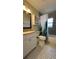 Bathroom featuring stylish tile, vanity, toilet and shower/tub combination at 4824 16Th St, Zephyrhills, FL 33542