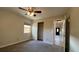 Bedroom with carpet, ceiling fan, window with blinds, and closet at 4824 16Th St, Zephyrhills, FL 33542
