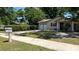 Charming brick home with a well-manicured lawn and a two-car garage at 4824 16Th St, Zephyrhills, FL 33542