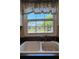 Kitchen sink beneath a window providing natural light and an outdoor view at 4824 16Th St, Zephyrhills, FL 33542