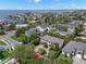 Aerial view showing a neighborhood with upscale homes and lush landscaping near the ocean at 5025 W Homer Ave, Tampa, FL 33629