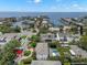 Aerial view of a beautiful waterfront community showing a luxurious home with pool and lush greenery at 5025 W Homer Ave, Tampa, FL 33629