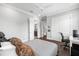 Bedroom featuring hardwood floors, access to bathroom and closet, and ceiling fan at 5025 W Homer Ave, Tampa, FL 33629