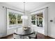 Dining area with views of the backyard pool at 5025 W Homer Ave, Tampa, FL 33629