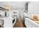 Bright kitchen featuring stainless appliances, white cabinetry, and central island with breakfast bar at 5025 W Homer Ave, Tampa, FL 33629