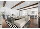 Bright living room with wooden beams open to the kitchen, and modern furniture at 5025 W Homer Ave, Tampa, FL 33629