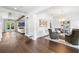 Open-concept living room boasting hardwood floors, high ceilings, and a seamless flow to other rooms at 5025 W Homer Ave, Tampa, FL 33629