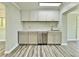 Stylish kitchen with modern cabinets, stainless steel appliances, and marbled countertops at 5043 Osprey Ln, New Port Richey, FL 34652