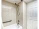 Well-maintained bathroom featuring a shower, grab bar, and modern fixtures at 5150 10Th N Ave # 302, St Petersburg, FL 33710