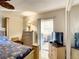 Comfortable bedroom with access to balcony, and a ceiling fan at 5150 10Th N Ave # 302, St Petersburg, FL 33710