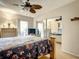 Bedroom features a ceiling fan, a mirror closet, and light filled window at 5150 10Th N Ave # 302, St Petersburg, FL 33710