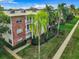 Brick accents add character to this condo building with manicured landscaping and palm trees at 5150 10Th N Ave # 302, St Petersburg, FL 33710