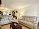 Comfortable living room with hardwood floors, neutral furnishings, and a calming atmosphere at 5150 10Th N Ave # 302, St Petersburg, FL 33710