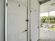 Hallway view of the outside storage units on the condo property with a peek at the outside surroundings at 5150 10Th N Ave # 302, St Petersburg, FL 33710
