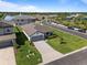 An aerial view of a landscaped single-Gathering home on a corner lot in a beautiful neighborhood at 5938 164Th E Ave, Parrish, FL 34219