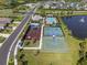 Aerial view of the basketball court, playground, community center, pool, and fountain at 5938 164Th E Ave, Parrish, FL 34219