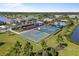 Aerial view of the basketball court, playground, and community center with surrounding landscaping at 5938 164Th E Ave, Parrish, FL 34219