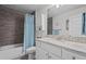 Well-lit bathroom with granite countertops, modern fixtures, and a shower with stylish tile at 5938 164Th E Ave, Parrish, FL 34219