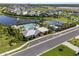 Aerial view of community center, pool, tennis courts, and playground surrounded by lush landscaping at 5938 164Th E Ave, Parrish, FL 34219