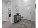 Inviting entryway features neutral tones, stylish decor, and durable tile flooring for a welcoming ambiance at 5938 164Th E Ave, Parrish, FL 34219