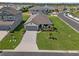 Charming single Gathering home with an attached two car garage and a long concrete driveway at 5938 164Th E Ave, Parrish, FL 34219