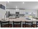 Spacious kitchen with granite counters, modern appliances, and stylish backsplash at 5938 164Th E Ave, Parrish, FL 34219