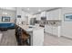 Open-concept kitchen with granite counters, white cabinets, and a view to the cozy living space at 5938 164Th E Ave, Parrish, FL 34219