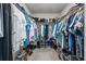 A fully-stocked walk-in closet featuring clothing racks, shelving, and shoe storage at 5938 164Th E Ave, Parrish, FL 34219