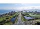 Expansive aerial view showcasing waterfront condos, bridge and cityscape beyond the bay at 6051 Sun Blvd # 111, St Petersburg, FL 33715