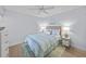 Calm bedroom featuring a queen bed, ceiling fan, and coordinated beachy decor at 6051 Sun Blvd # 111, St Petersburg, FL 33715