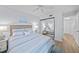 Bright bedroom with mirrored closet doors reflecting the room at 6051 Sun Blvd # 111, St Petersburg, FL 33715