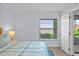 Stylishly decorated bedroom with ceiling fan, and water view at 6051 Sun Blvd # 111, St Petersburg, FL 33715