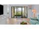 Inviting living room with screened lanai, water view, and comfortable seating area at 6051 Sun Blvd # 111, St Petersburg, FL 33715