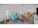 Open-concept living area with modern furnishings and an adjacent bedroom and kitchen at 6051 Sun Blvd # 111, St Petersburg, FL 33715