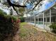 Lovely, secluded backyard featuring the screened in lanai and pool and plenty of privacy landscaping at 6805 Monet Cir, Temple Terrace, FL 33617