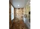 This tiled shower includes a glass block window and a built-in shower bench at 6805 Monet Cir, Temple Terrace, FL 33617