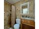 Bathroom featuring a shower and a vanity with sink and mirror at 6805 Monet Cir, Temple Terrace, FL 33617