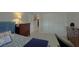 Bedroom featuring a closet, dresser, and view into the hallway with decor at 6805 Monet Cir, Temple Terrace, FL 33617