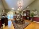 This dining room features hardwood floors, a dining table, and lots of natural light at 6805 Monet Cir, Temple Terrace, FL 33617