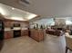 Open kitchen with granite countertops, stainless steel appliances, and seamless flow to the living area at 6805 Monet Cir, Temple Terrace, FL 33617