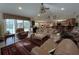 Open living area featuring leather furnishings and an open transition to kitchen and dining area at 6805 Monet Cir, Temple Terrace, FL 33617